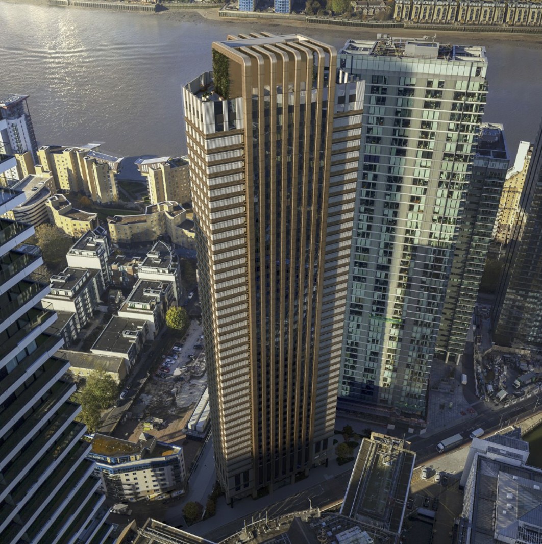 Aerial view of the bronze-clad tower at 30 Marsh Wall, Canary Wharf, beside the river and surrounding high-rise buildings